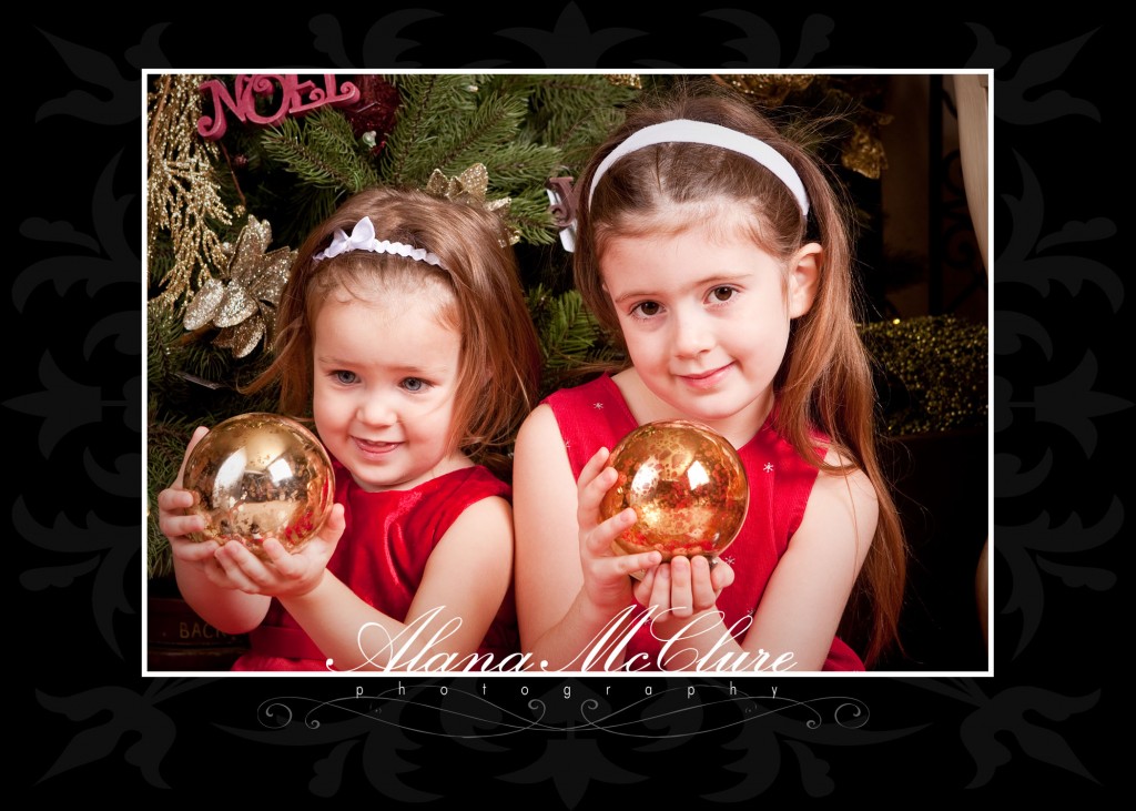 Ajax Christmas Photographer - Sisters with Ornaments